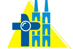 Logo z grafiką katedry wrocławskiej i krzyża na żółtym trójkątnym tle z napisem: grupa medialna Johanneum